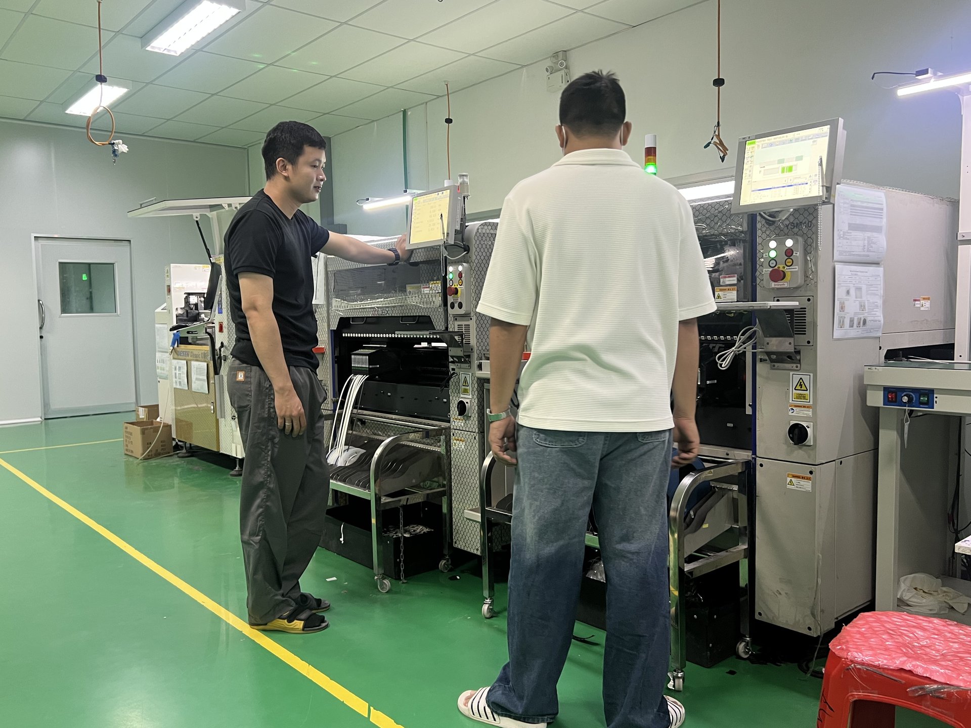 Full SMT line overview showing Yamaha pick-and-place, conveyor, reflow oven