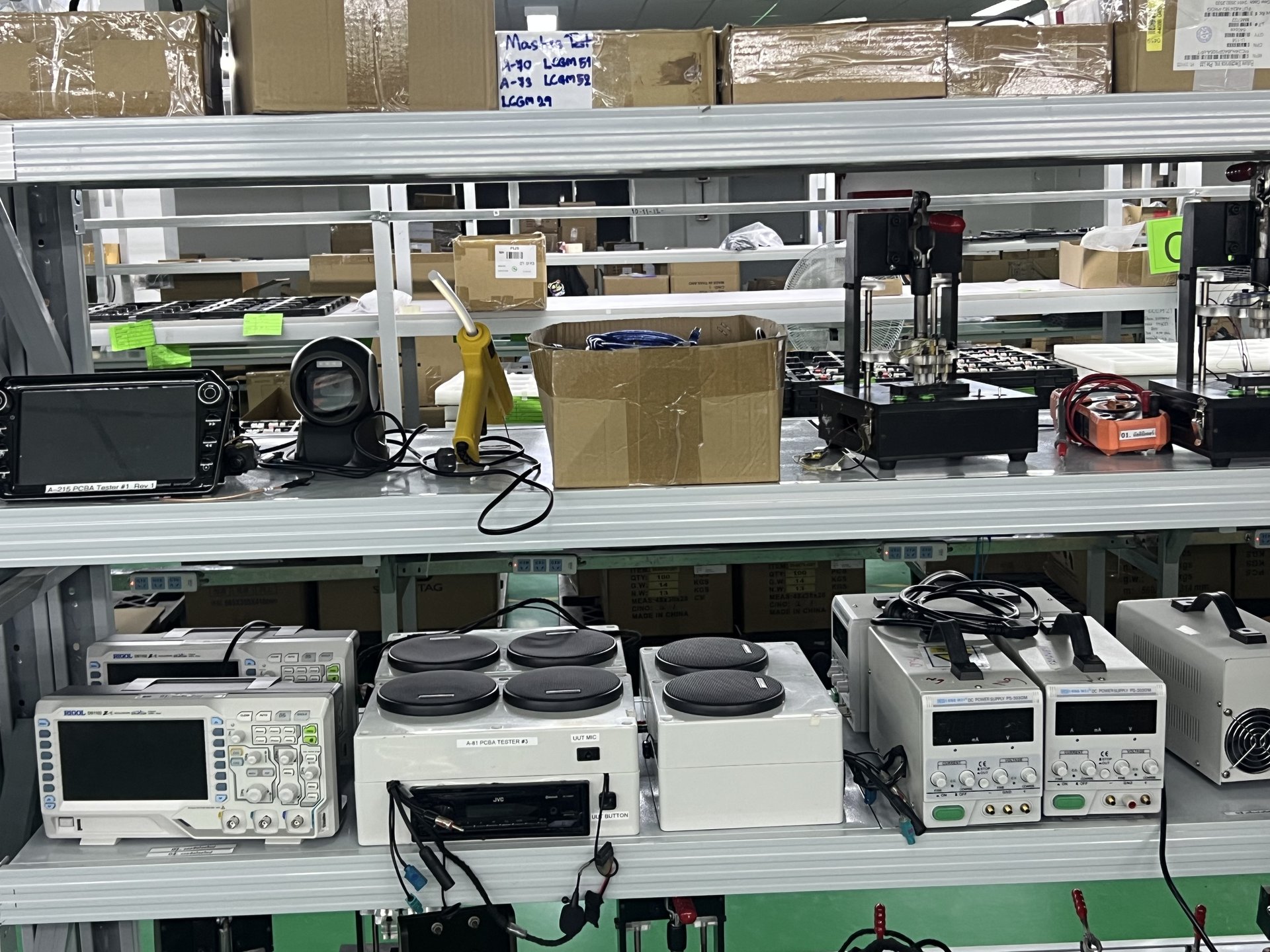 Engineering test equipment rack with Rigol oscilloscopes, DC power supplies, and DC electronic load